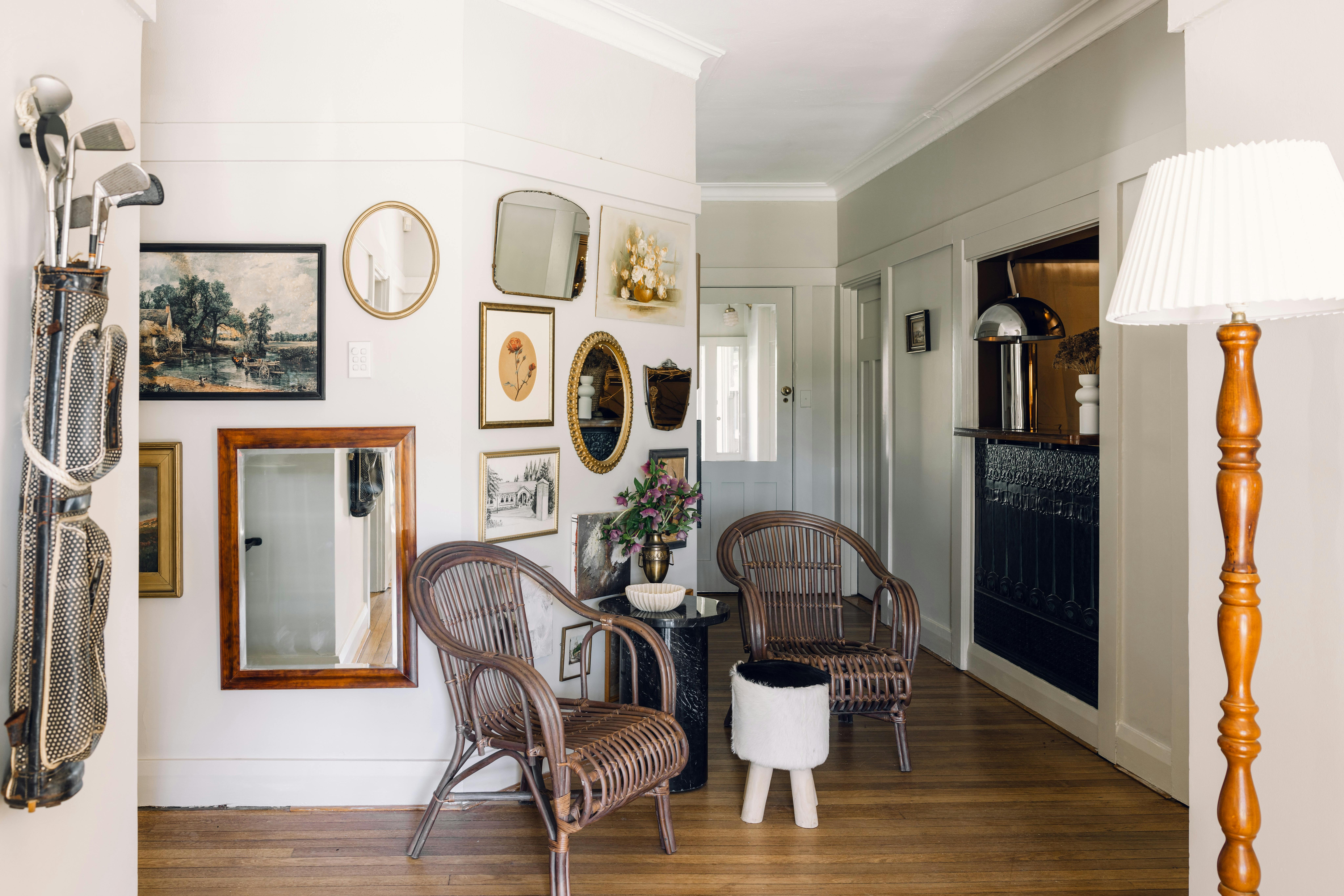 Hotel entrance showing art on wall , seating area and check in counter