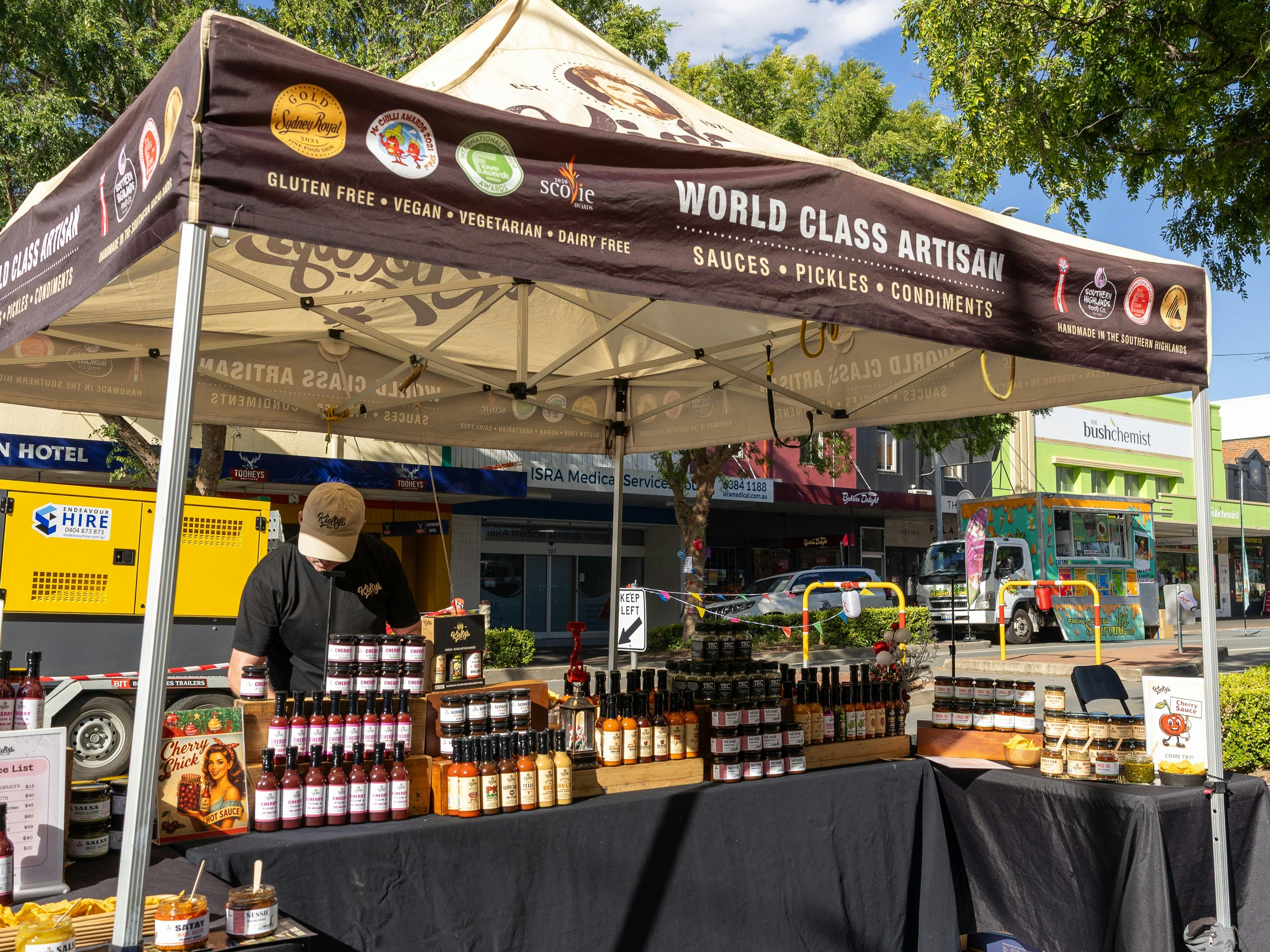 Stallholder with an array of Irish and other culturally inspired sauces.
