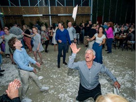 Greek man throwing plates