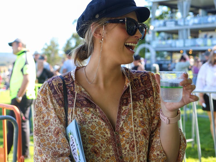 Lady enjoying a Gin tasting and laughing