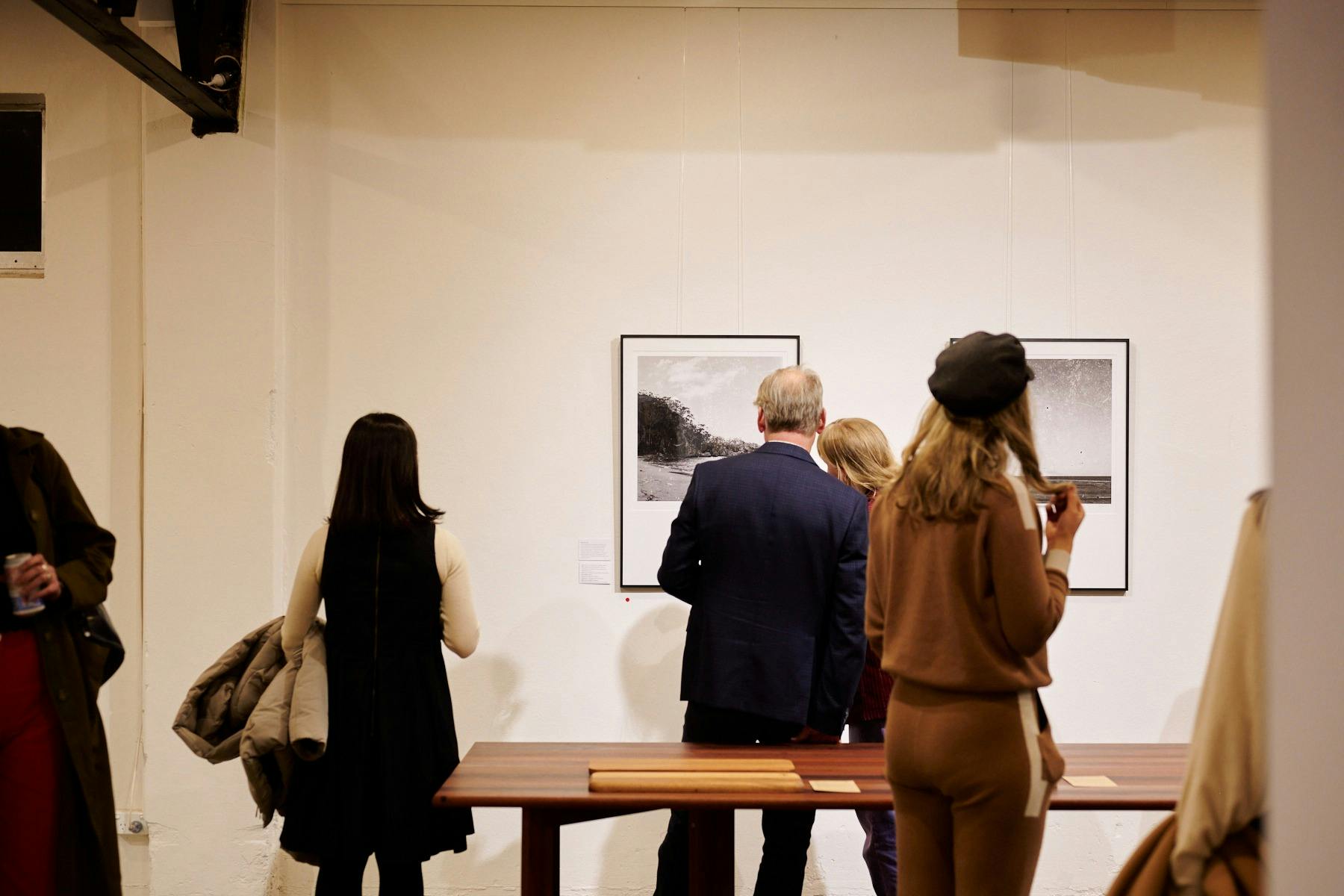 Visitors looking at work by Sammy Hawker