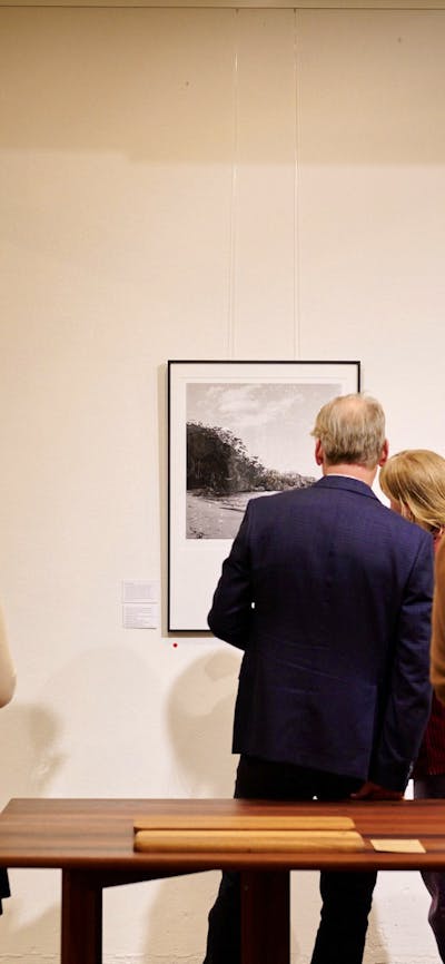 Visitors looking at work by Sammy Hawker