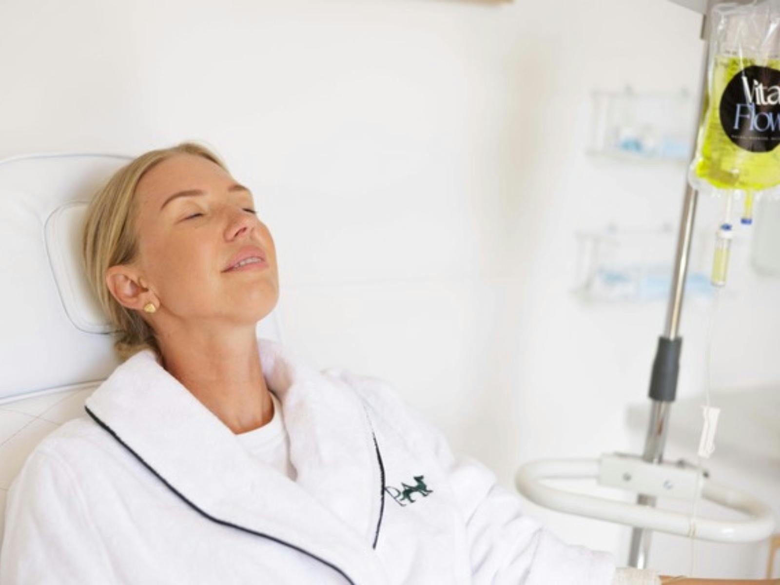 Relaxed woman receiving IV Vitamin therapy