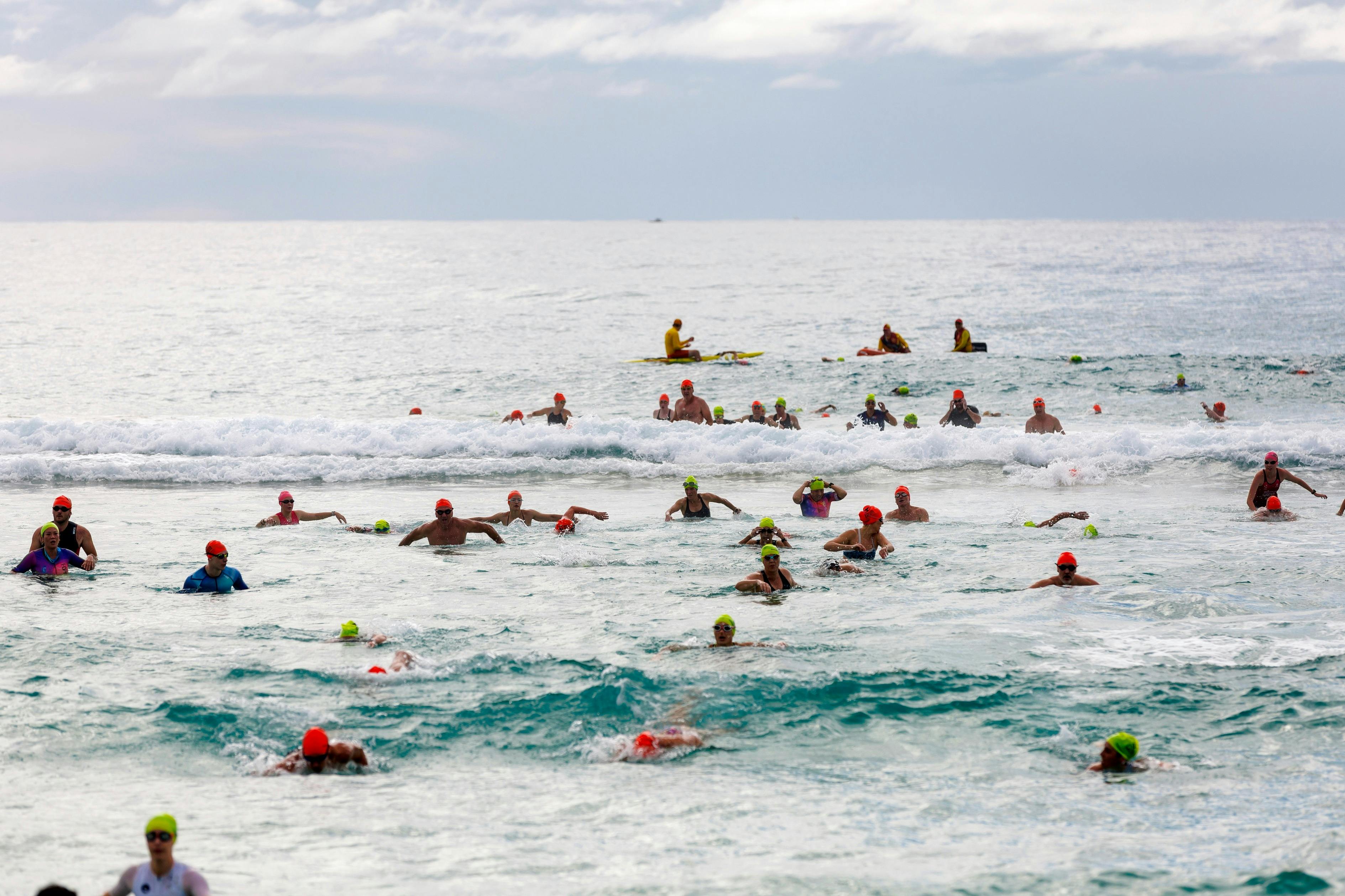 people swimming in ocean