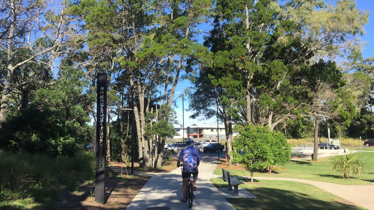 photo of a man riding a bicycle along the shared pathway near Seafront Oval