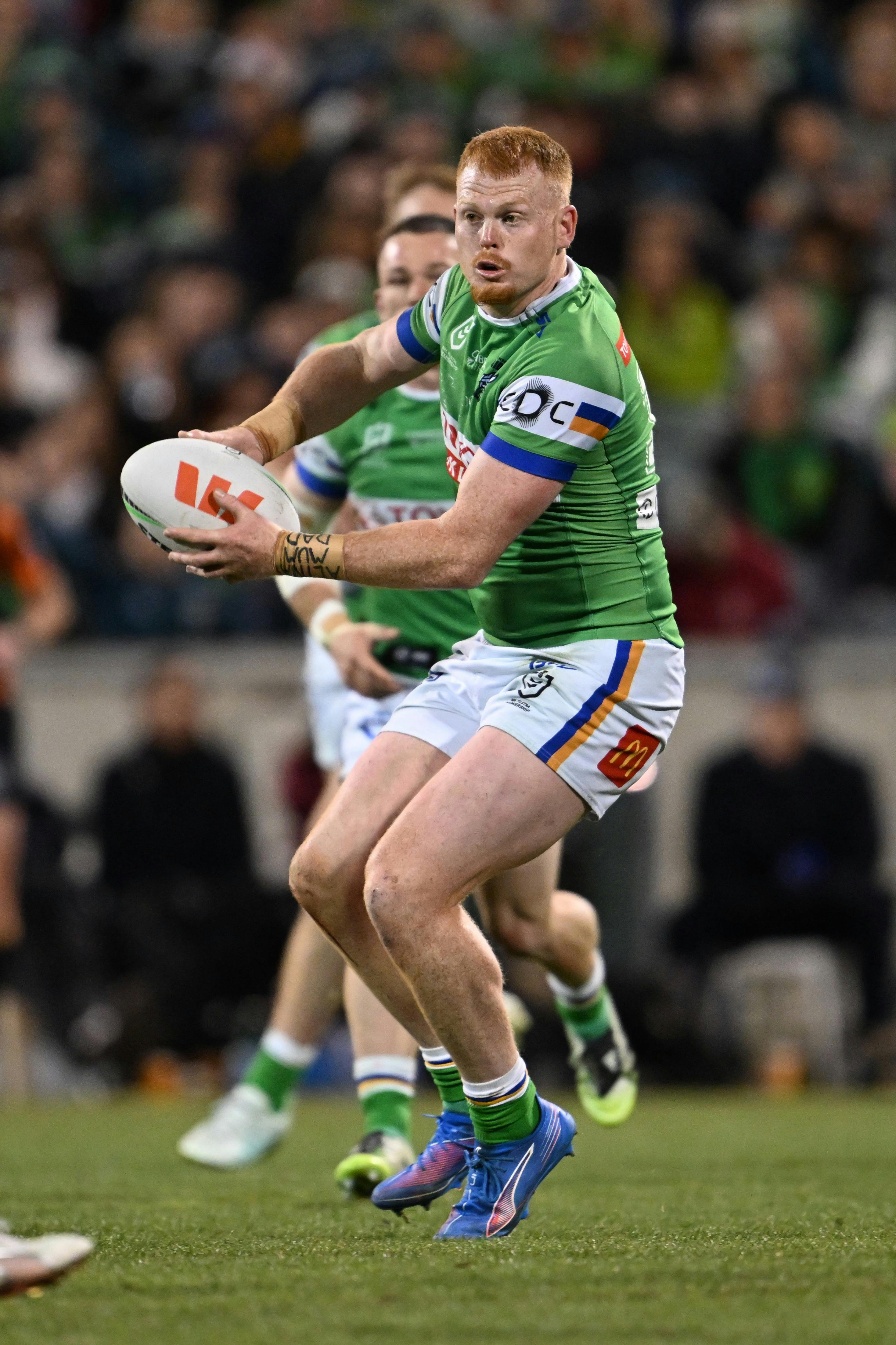 Canberra Raiders player Corey Horsburgh passing the ball.