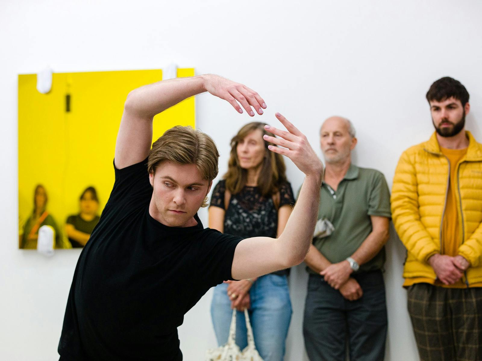 Person with arms outstretched above their head dancing Person with arms outstretched above their head dancing