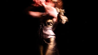 Blurred body in motion with black background