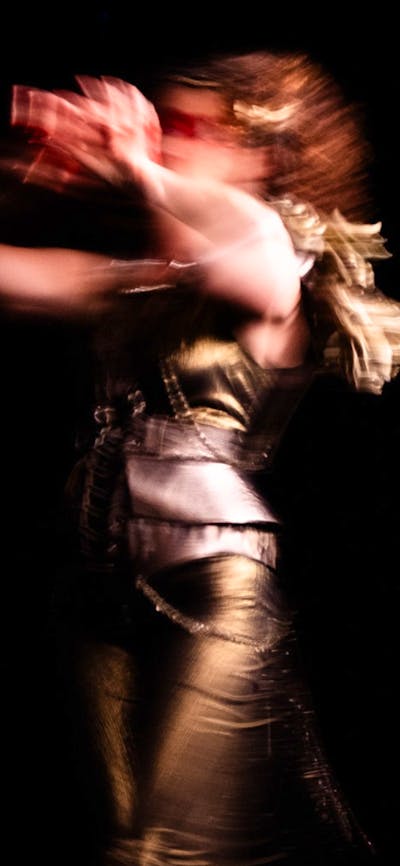 Blurred body in motion with black background
