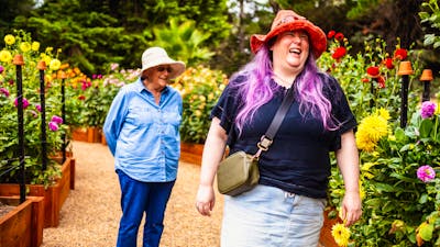 Two women enjoying the gardens at Harvest Day Out