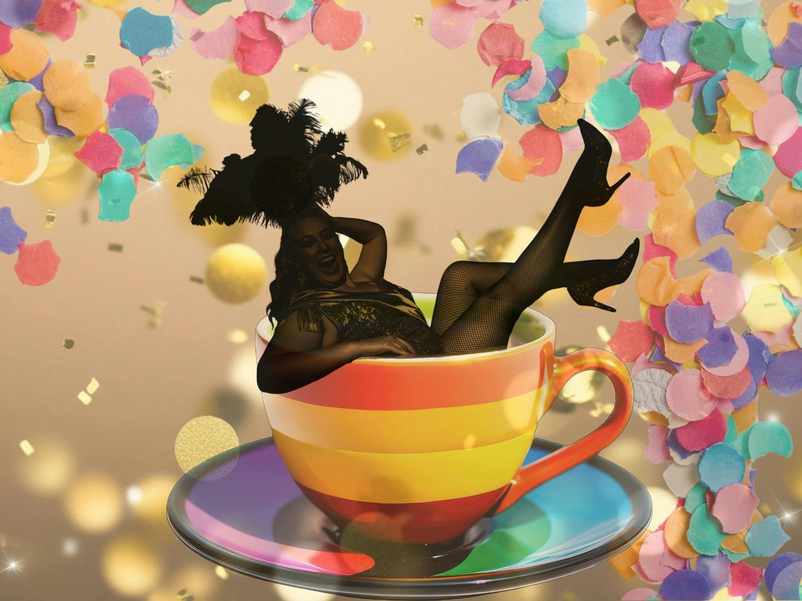 Performer posing inside a rainbow teacup with confetti falling around her.