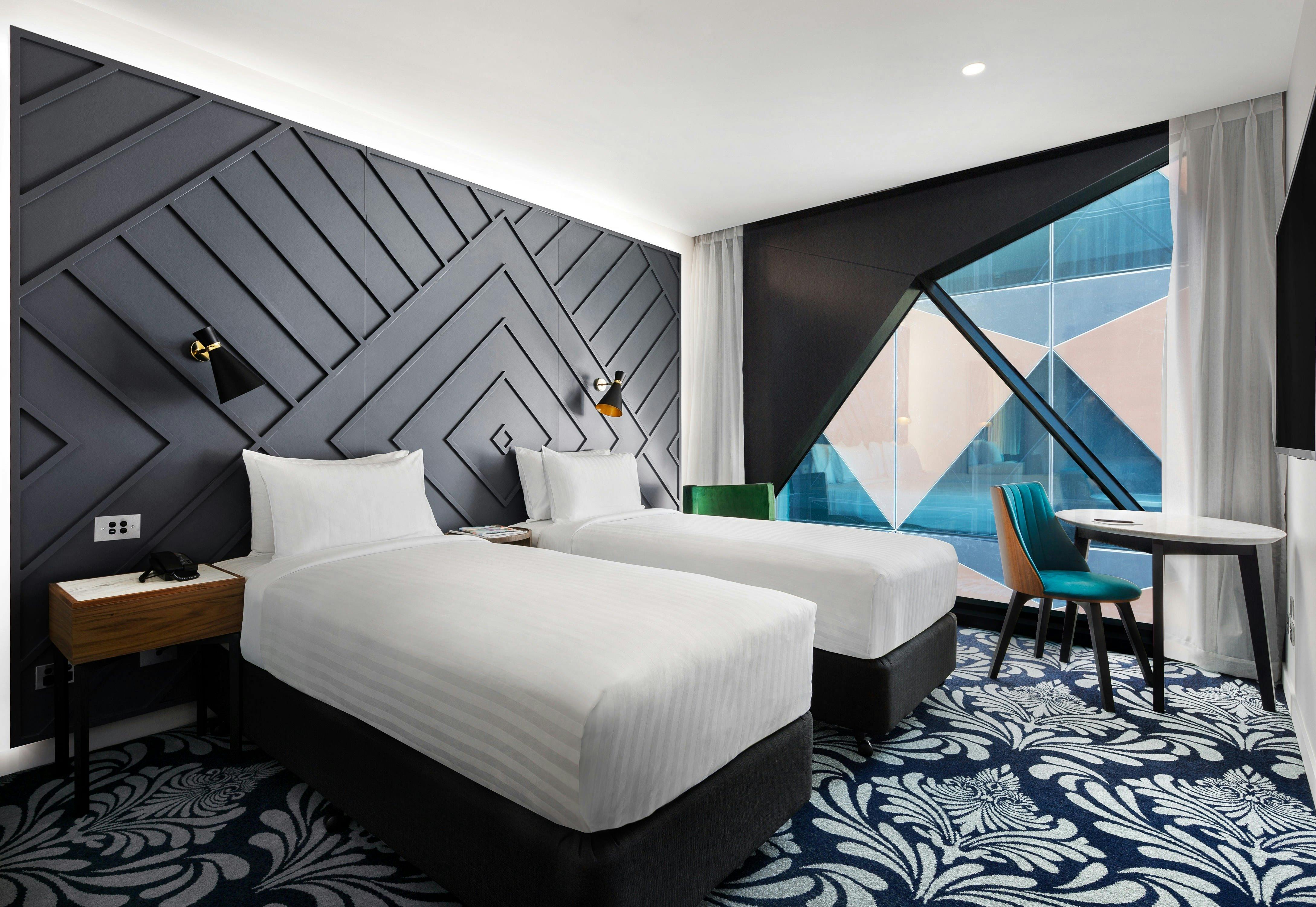 Twin Banksia Rooms enjoy light-industrial furnishings, 49-inch TV and capsule coffee machine.
