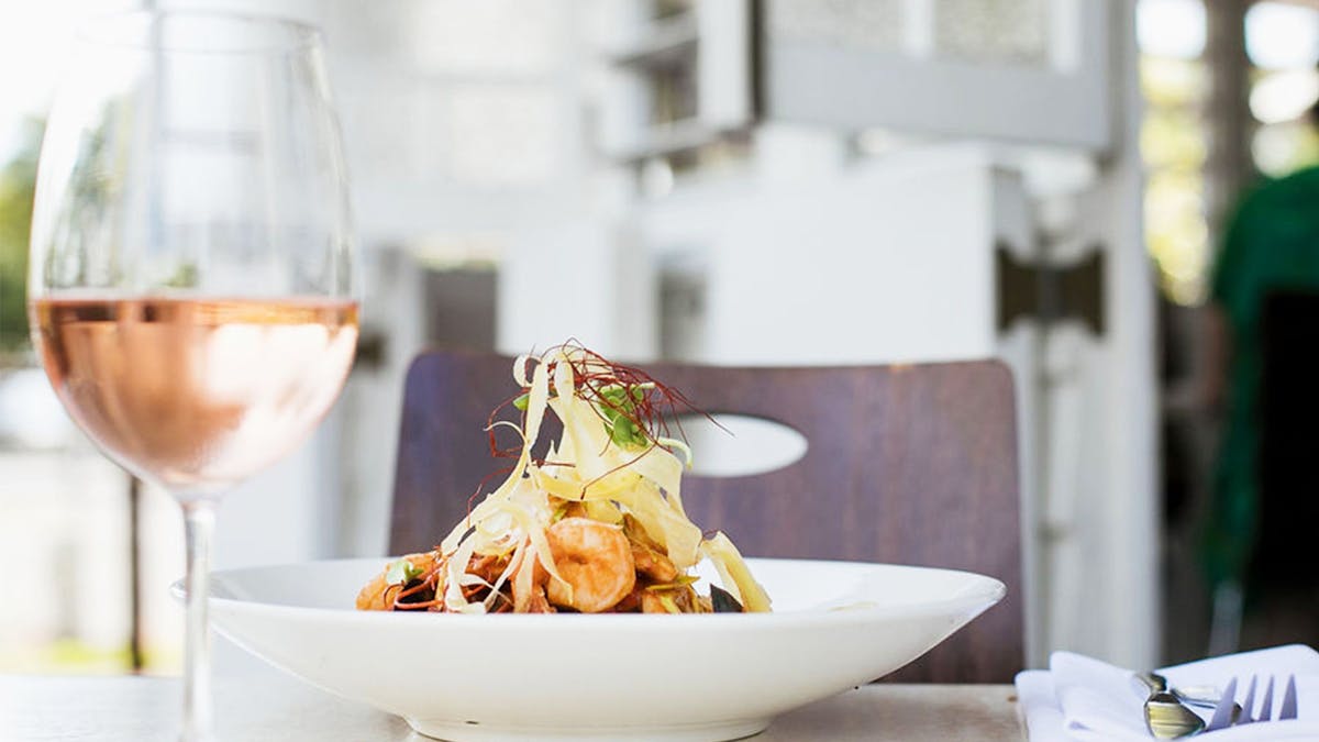 Experience the beauty of the tropics from our open aired Queenslander restaurant