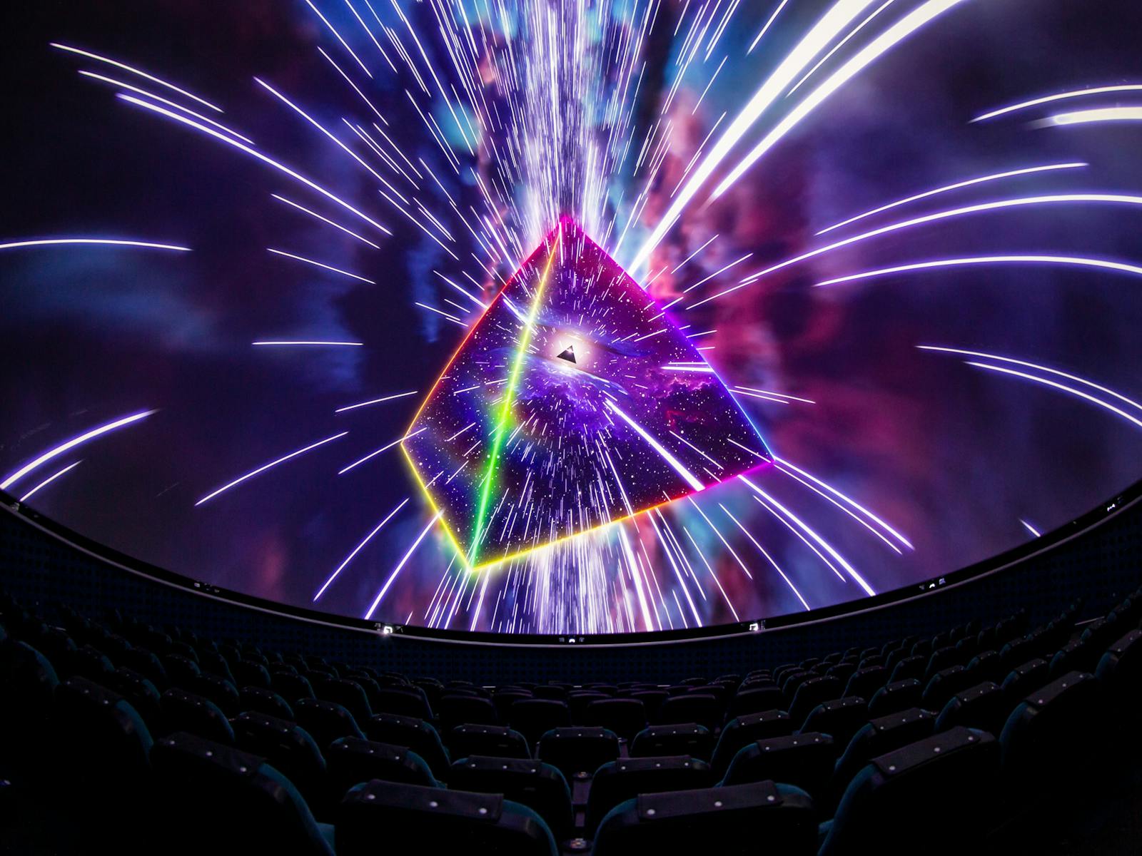 Image from the Dark Side of the Moon planetarium show, depicting a prism and neon lights.