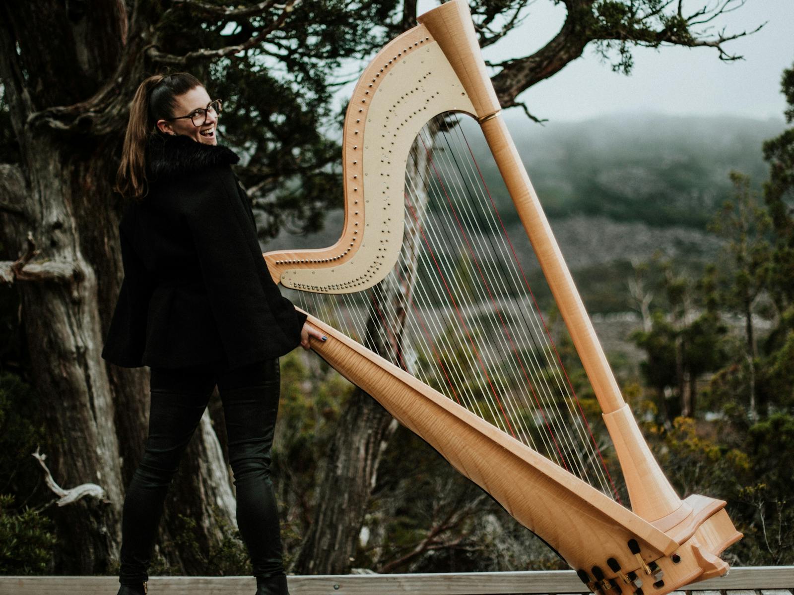 Emily pictured with a harp