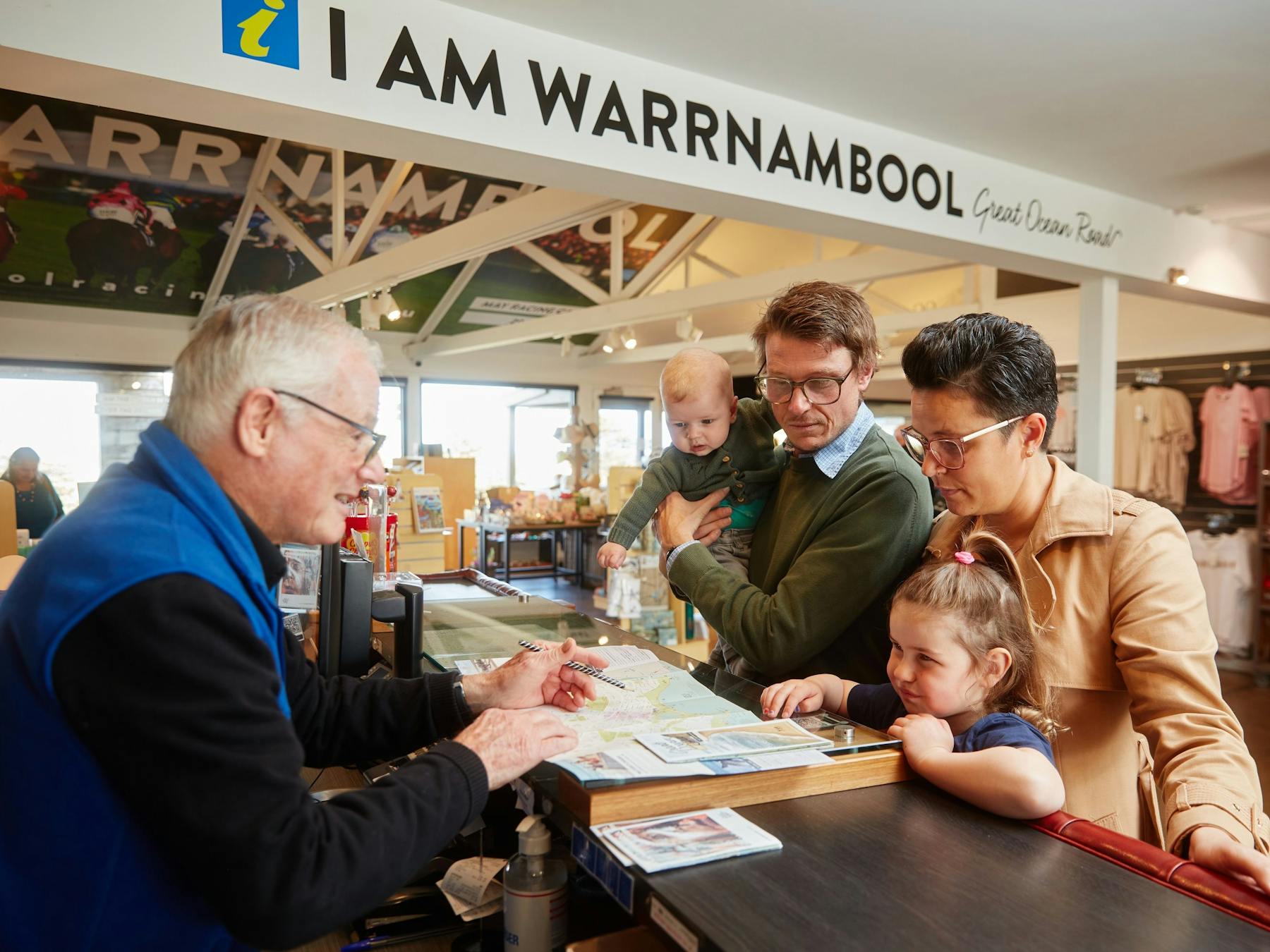 Staff at the visitor centre helping a family
