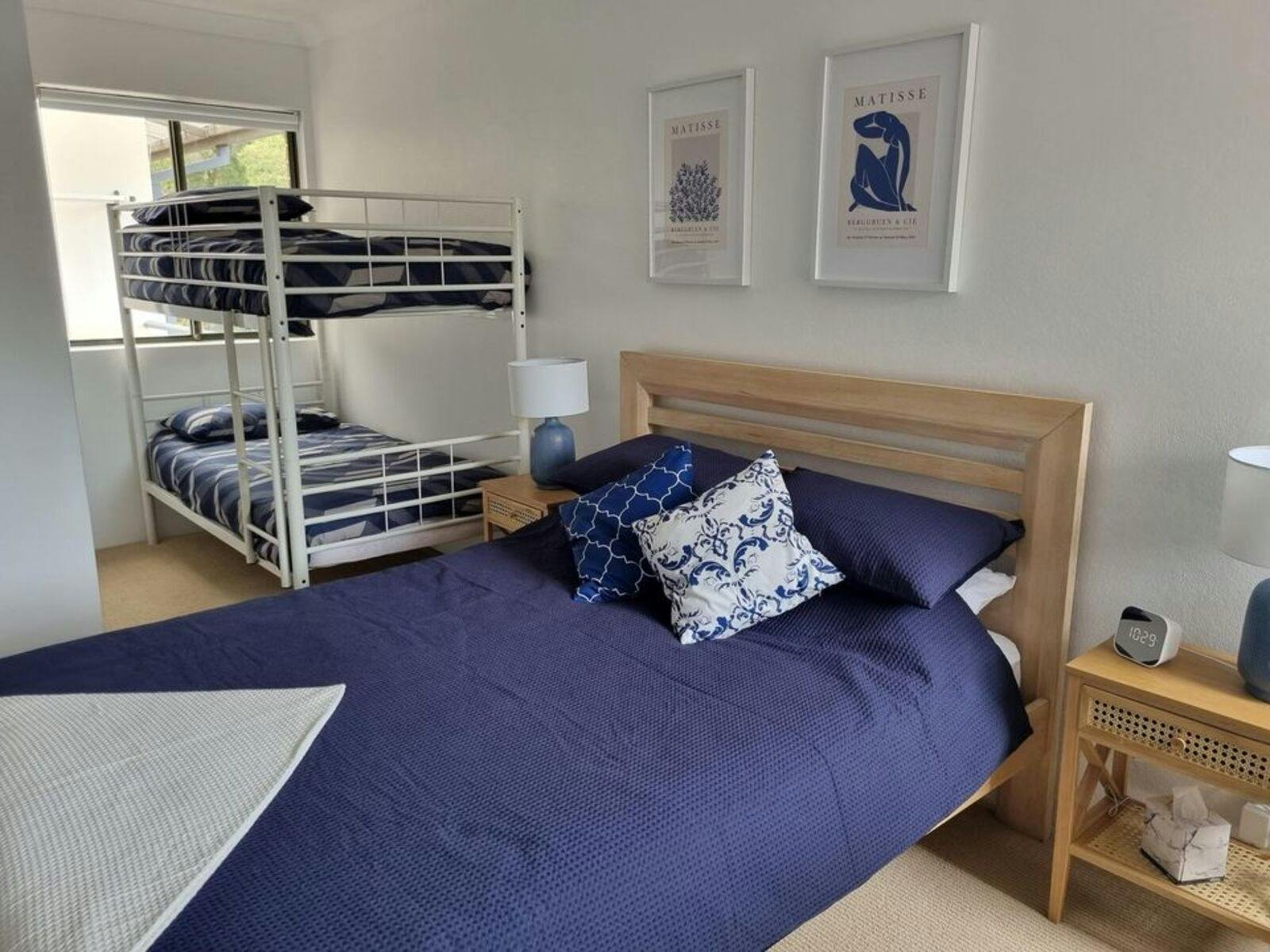 Second bedroom with queen bed and bunk beds