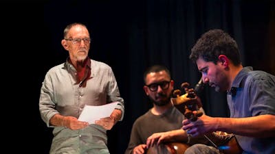 Artists standing together holding their instruments