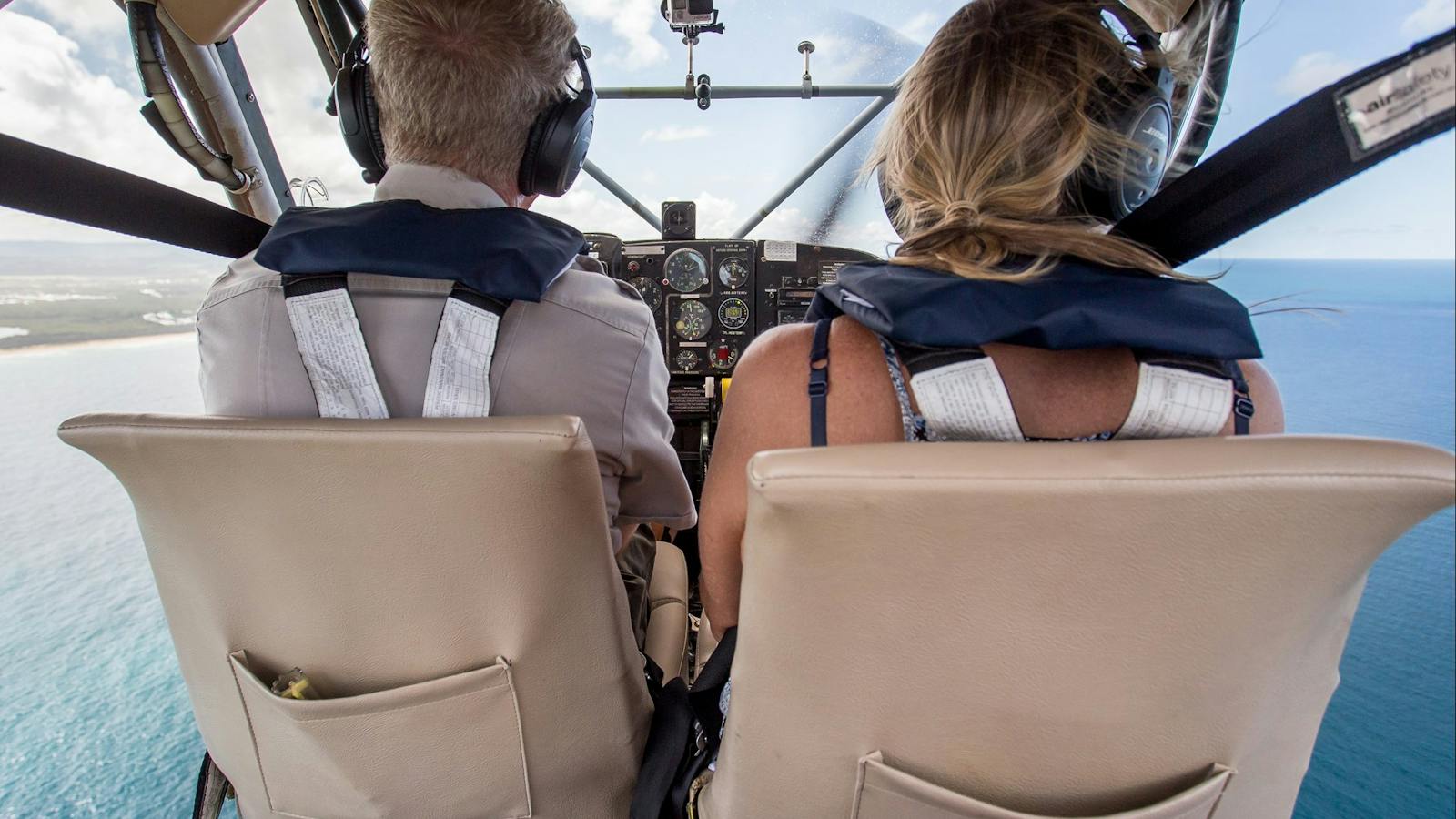 Picture of pilot and passenger with doors off views