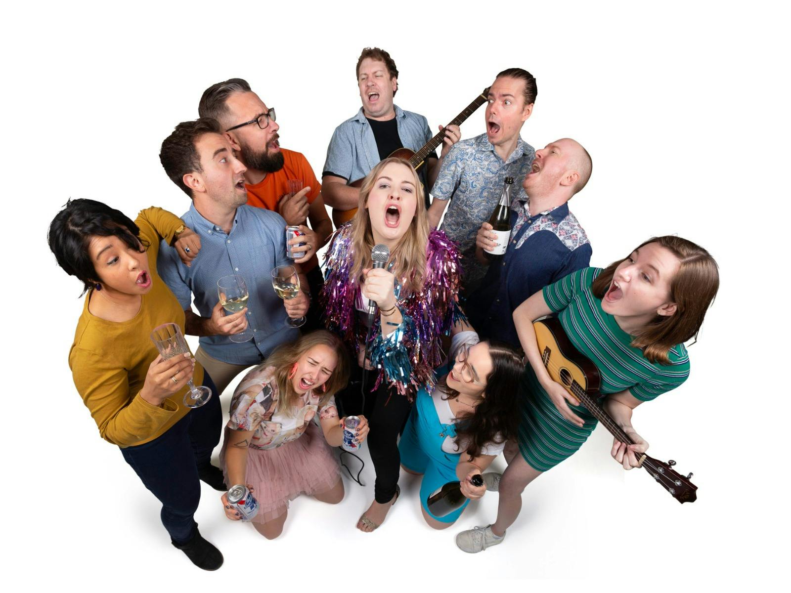 Group of people rock out, some hold beer and other hold instruments