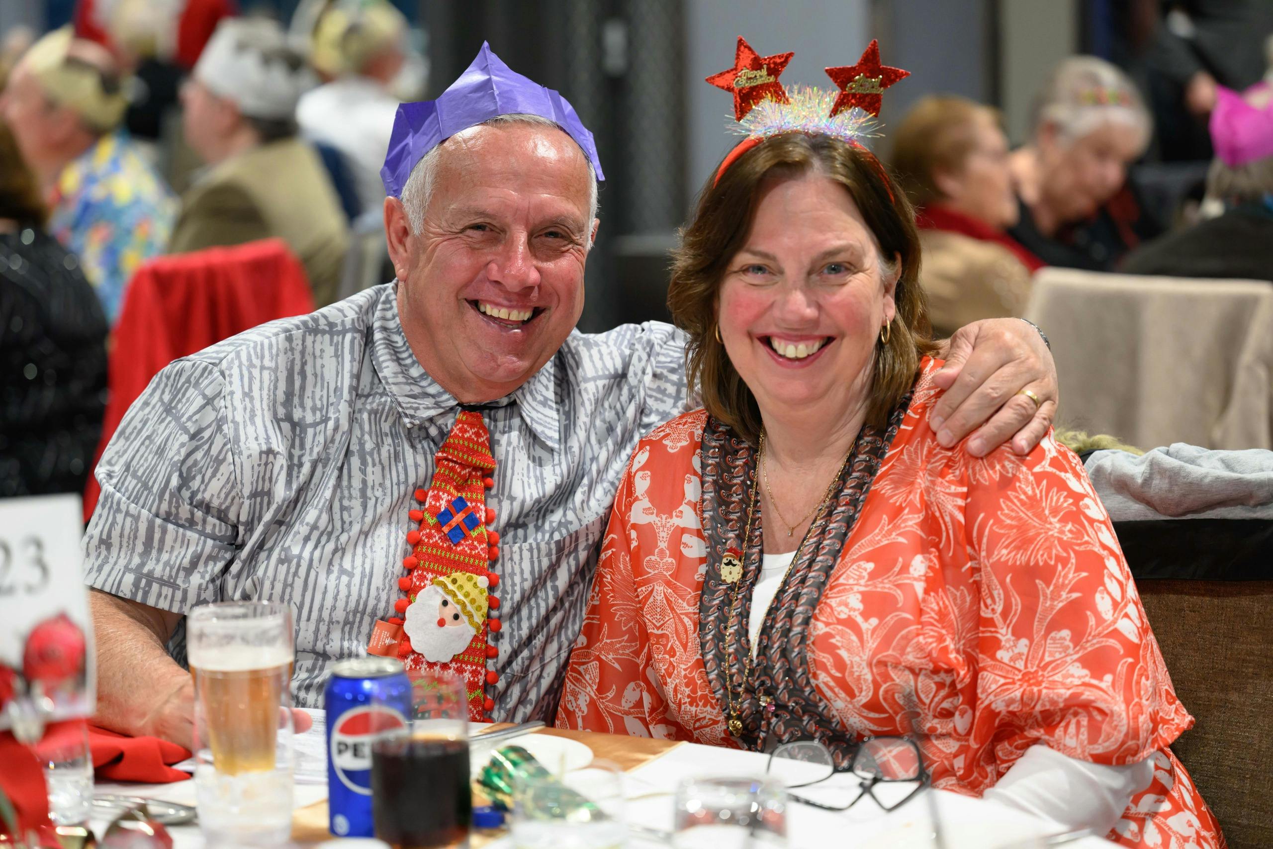 Two people with Christmas hats