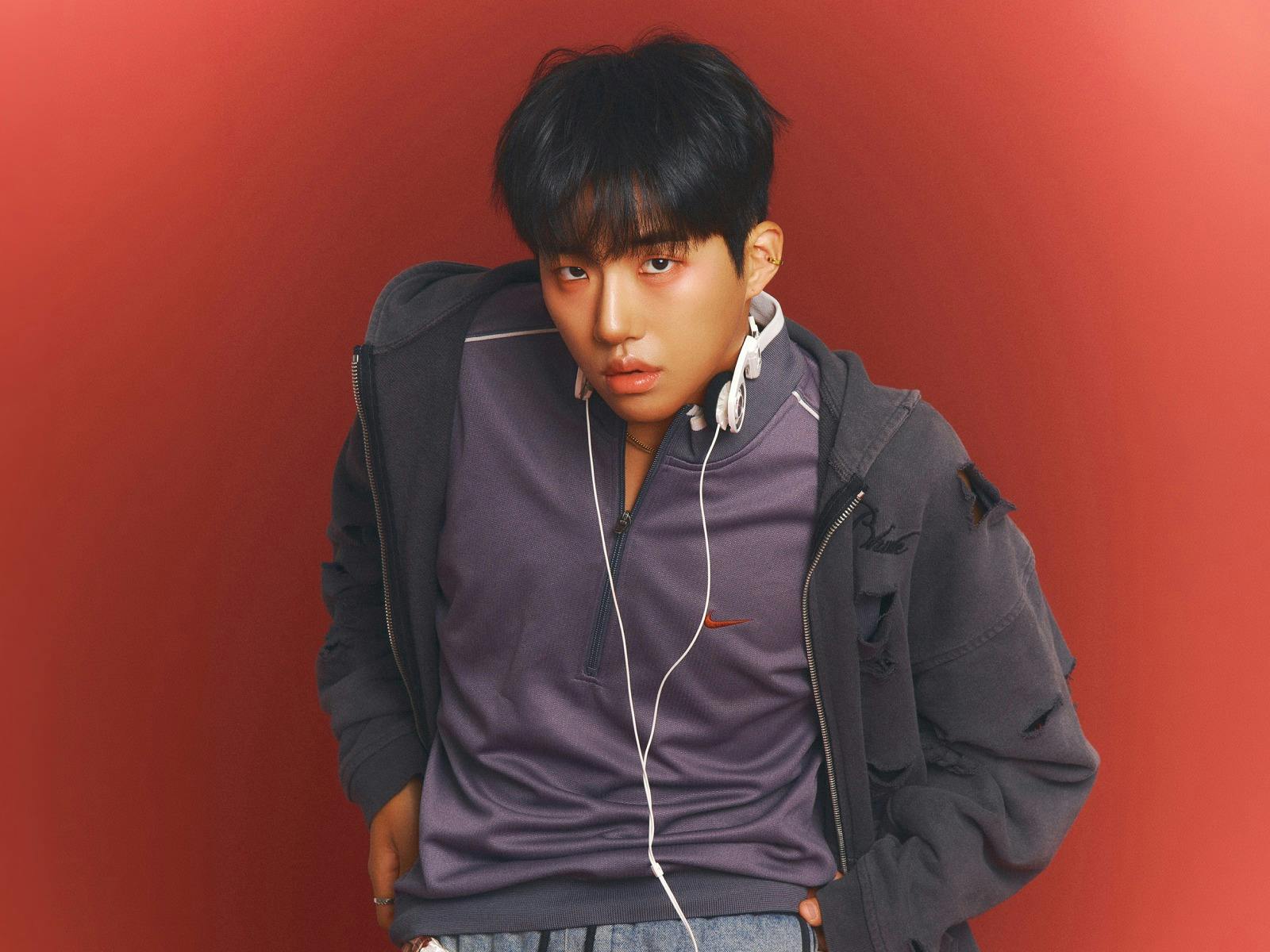 Photo of KINKY with a red background