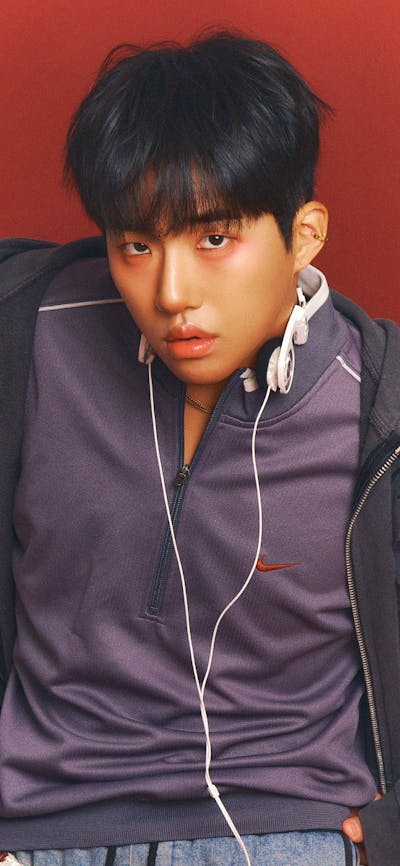 Photo of KINKY with a red background