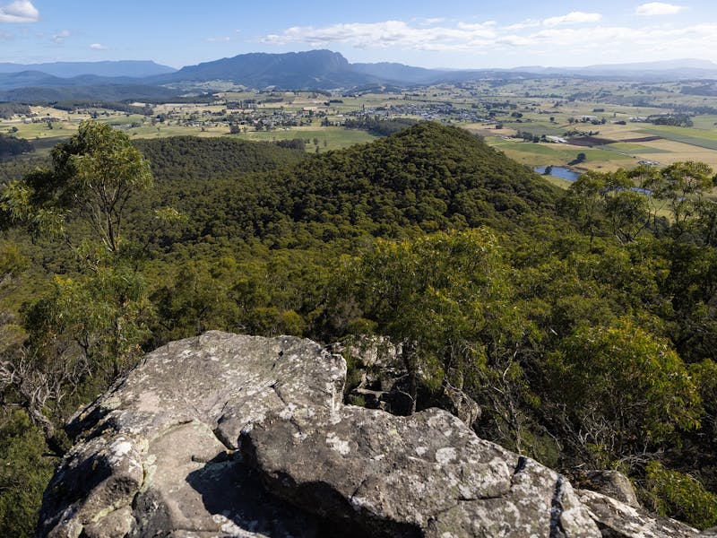 Granit rocks reach out from the peak, and valley below