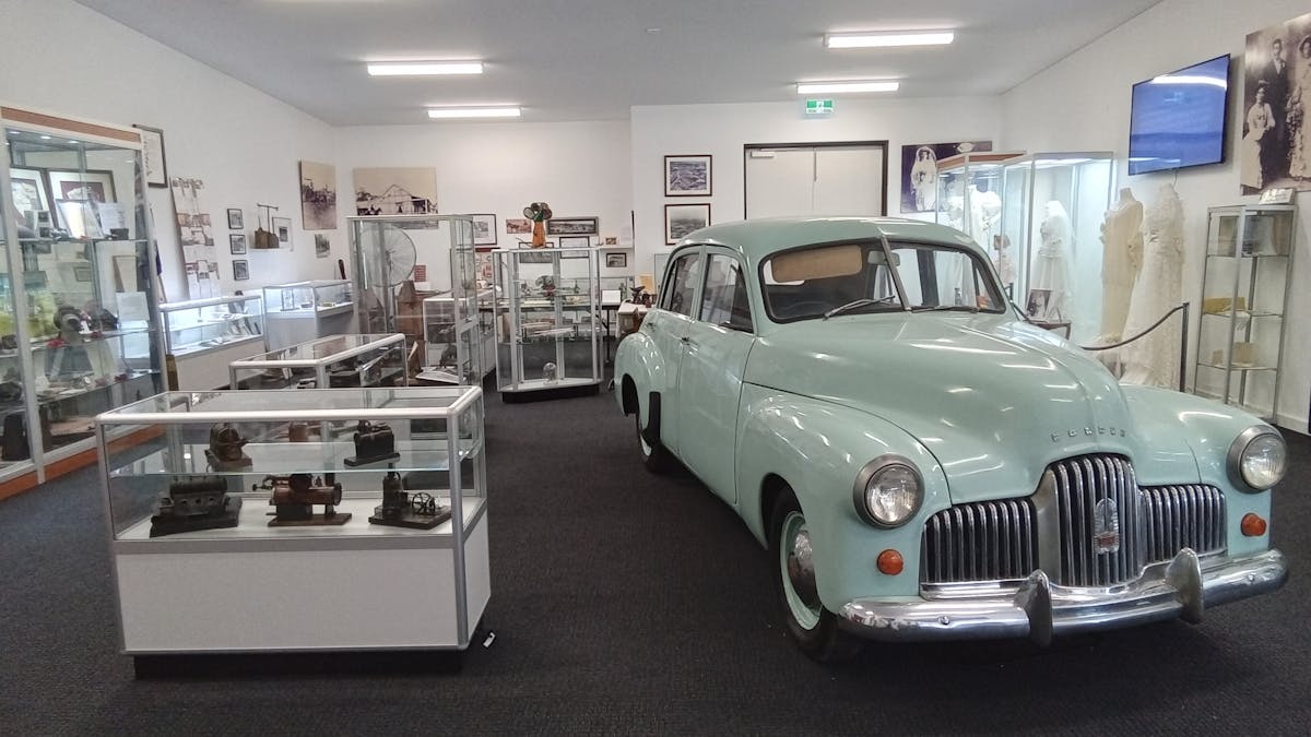 Main display area of exhibition displays. Forefront of the picture is a 1948 Holden Sedan.
