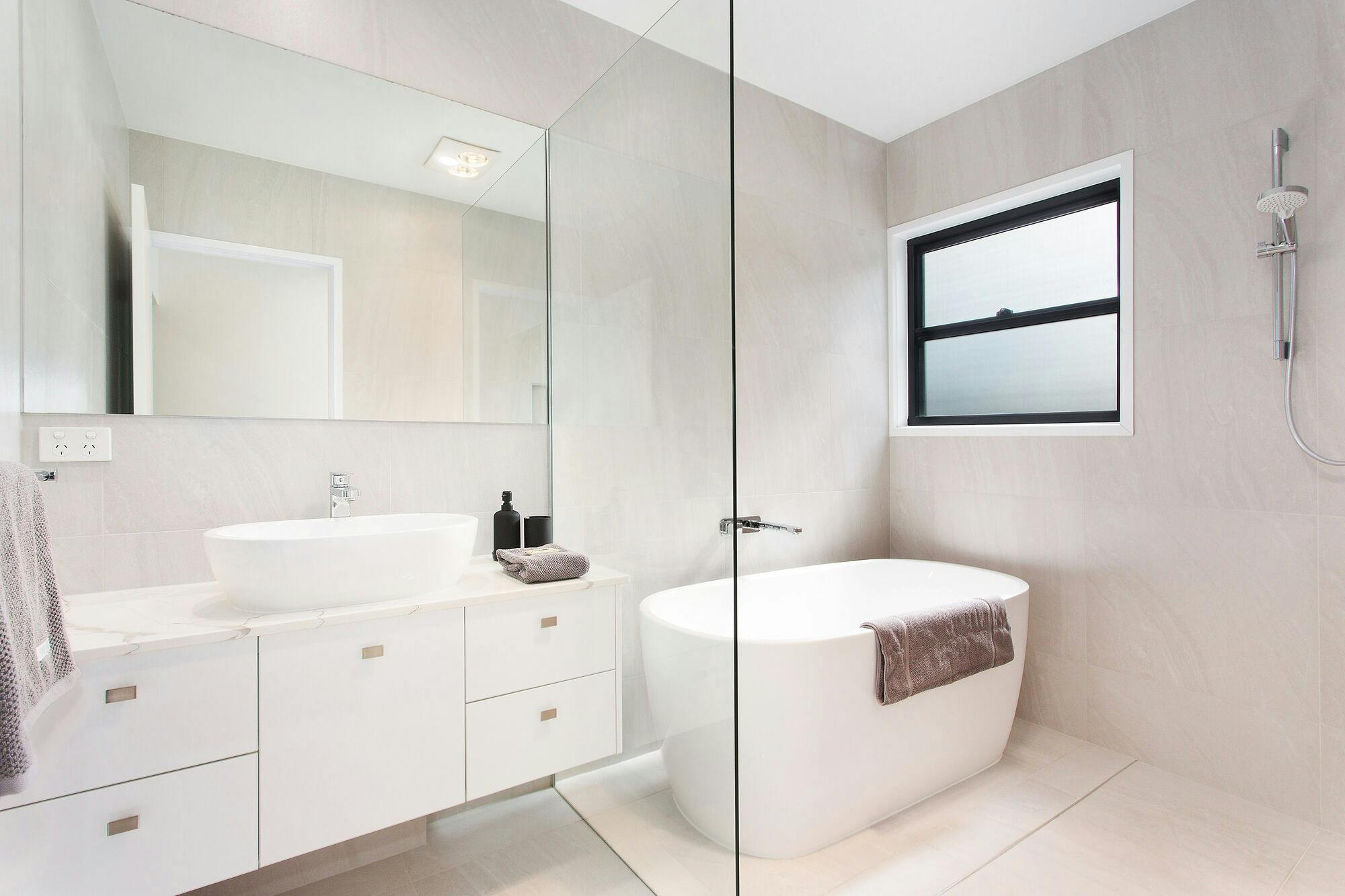 Main bathroom with separate bath and shower