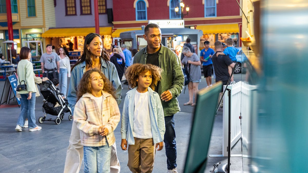 Family at night market food stall