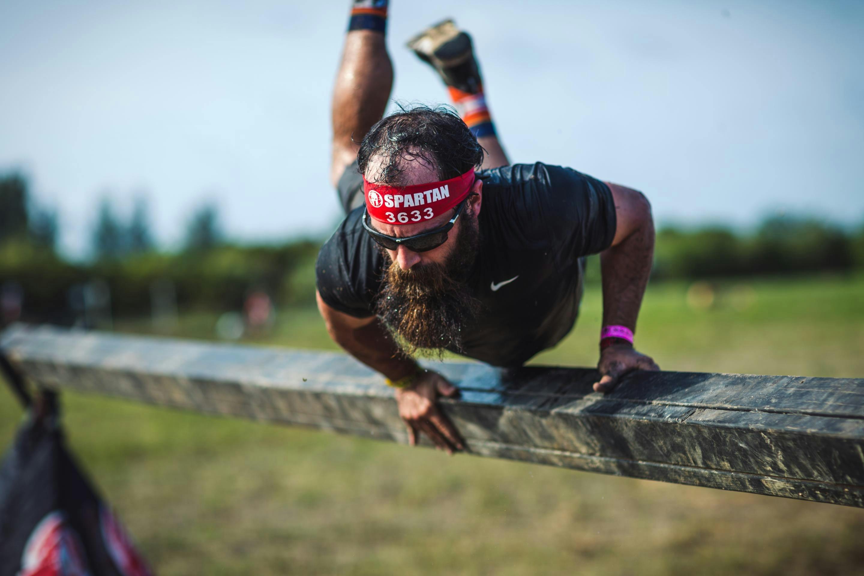 A person competes in Spartan Race.