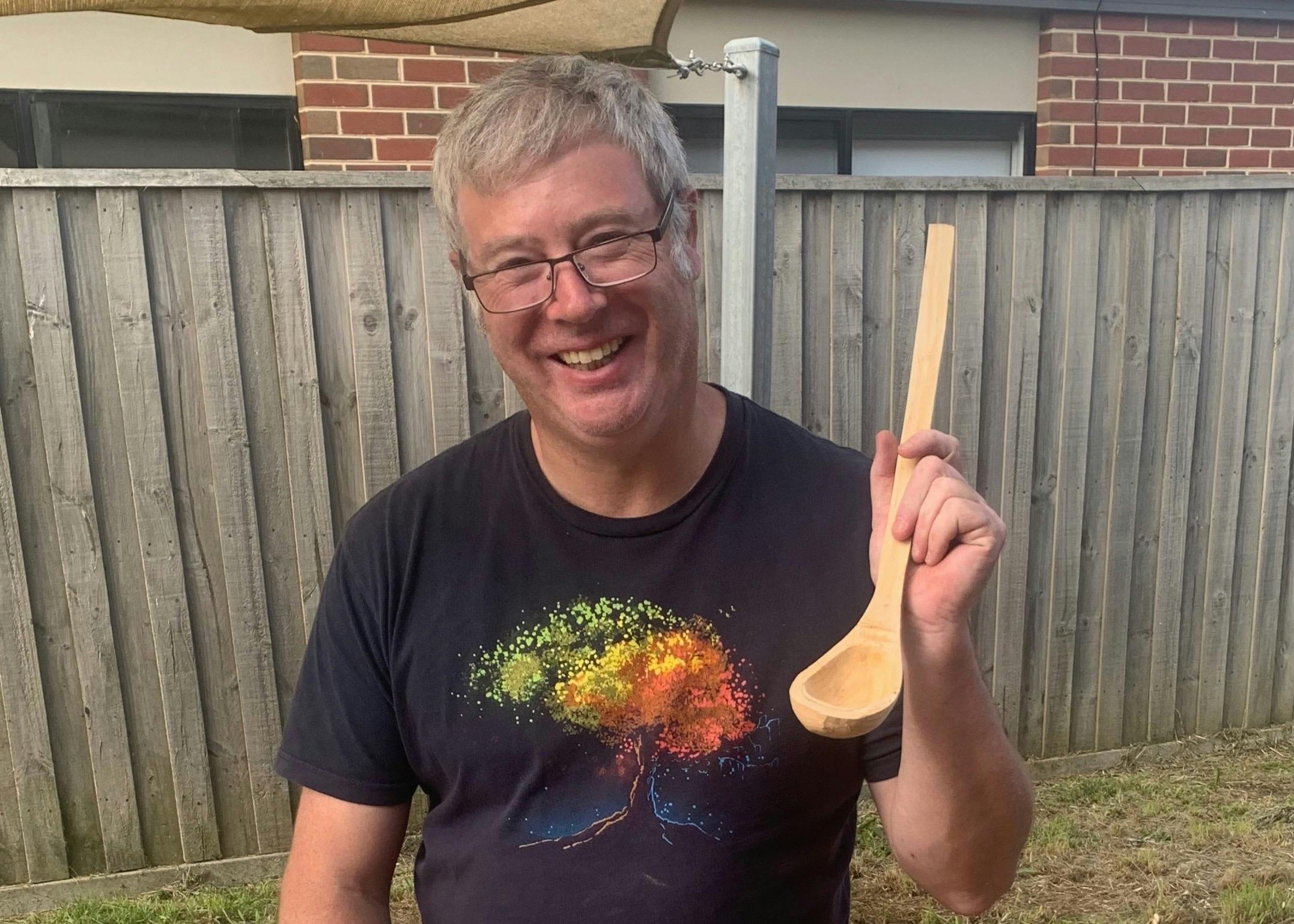 Smiling Participant Holding His Finished Ladle