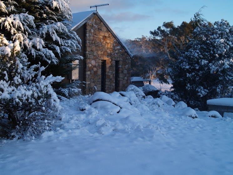 Bush Rock Cottage with occasional winter snow.