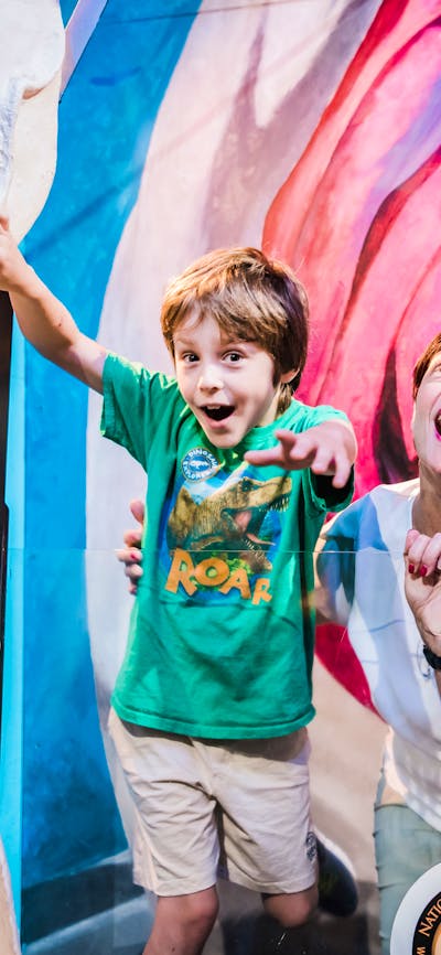 Little boy, auntie and teenage girl pose for a photo