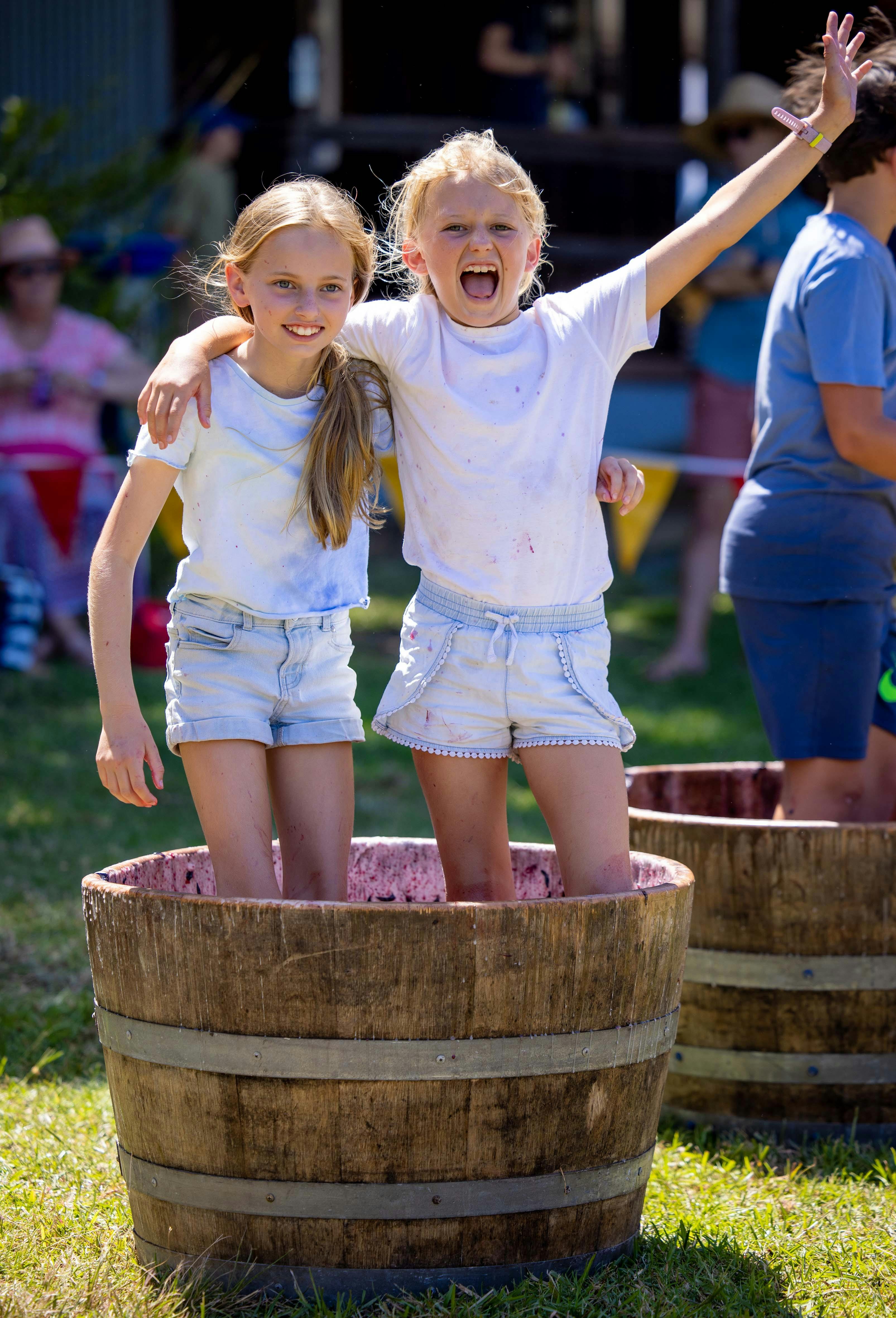 kids in barrell of grapes