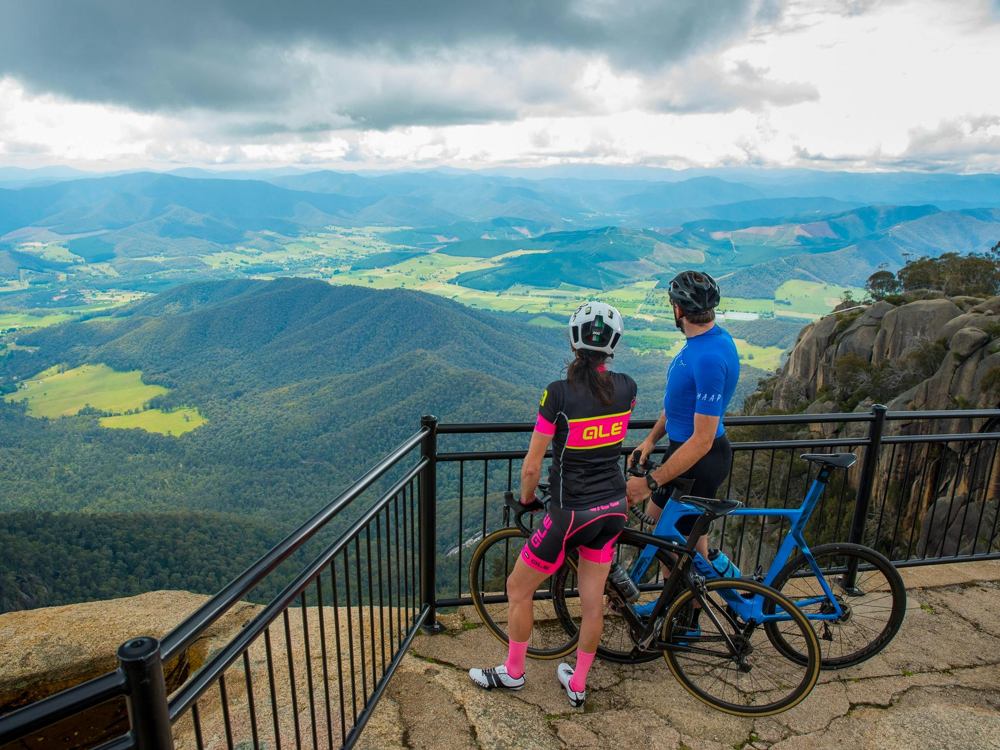 Road cyclists at The Gorge lookout on top of Mount Buffalo