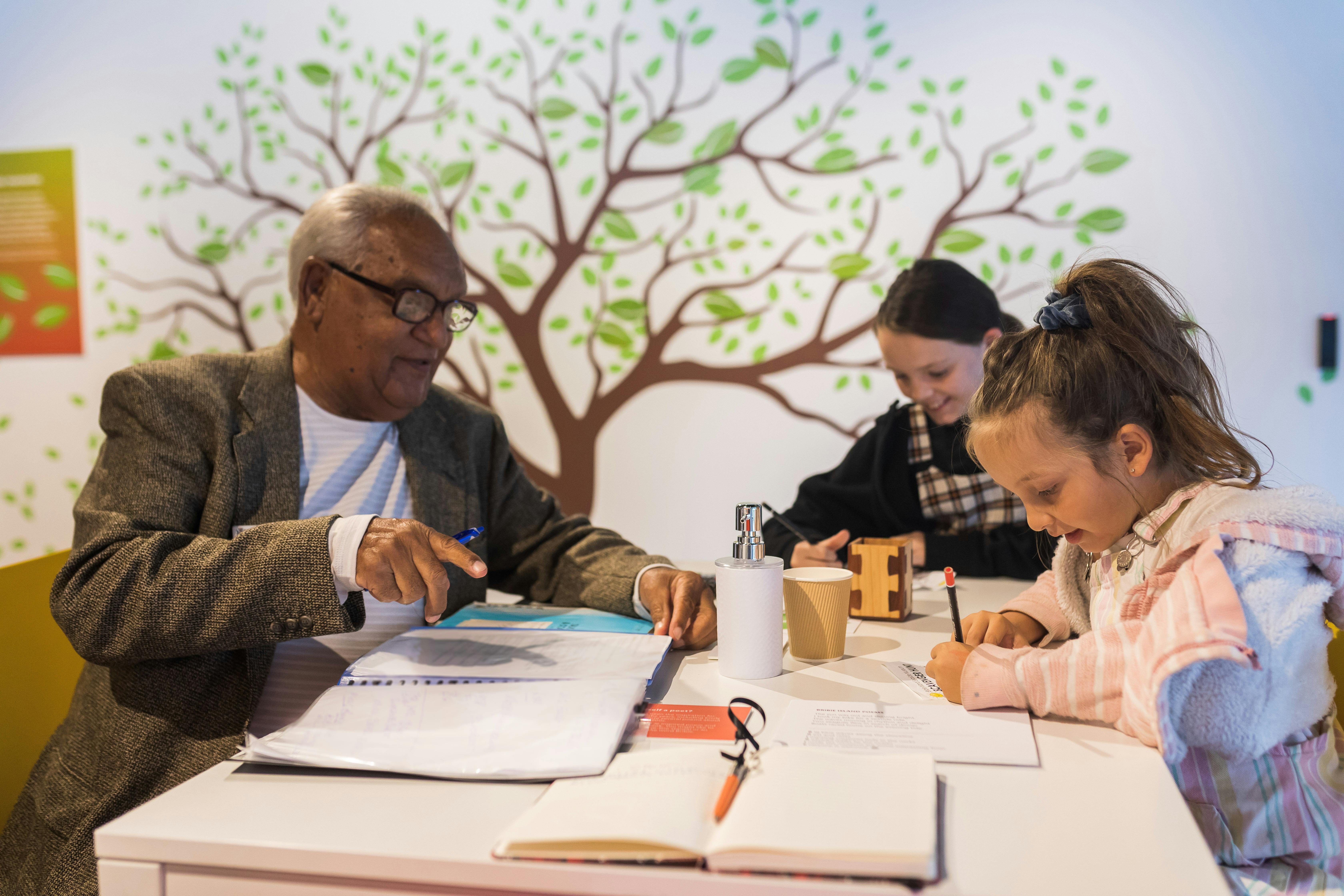 Man with two kids participating in museum activity