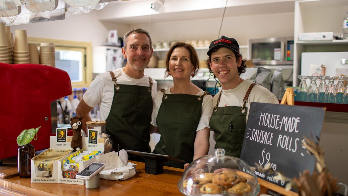 friendly staff greeting customers at the front counter