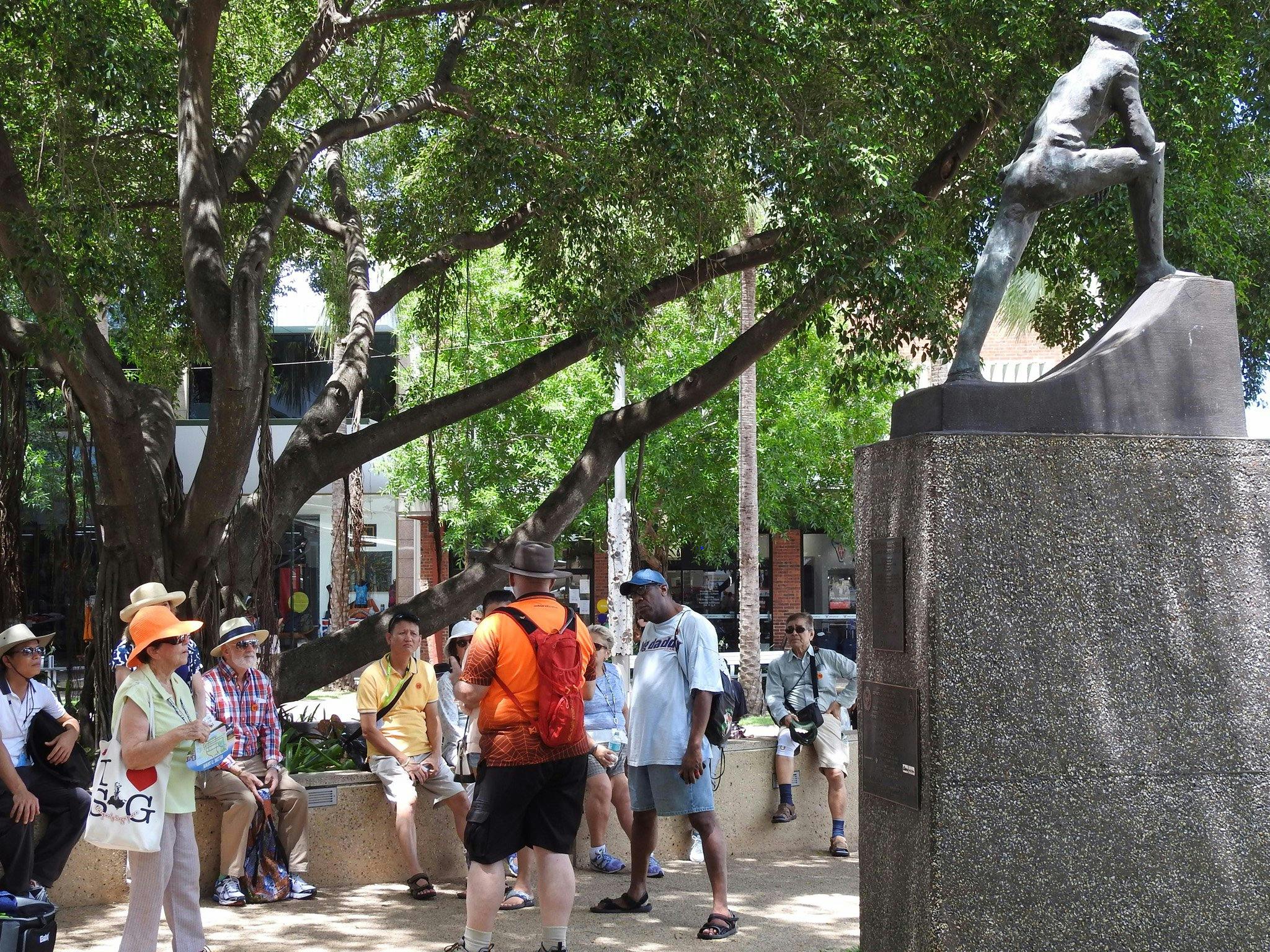 Cruiseship group under a shady tree at John McDouall Stuart statue