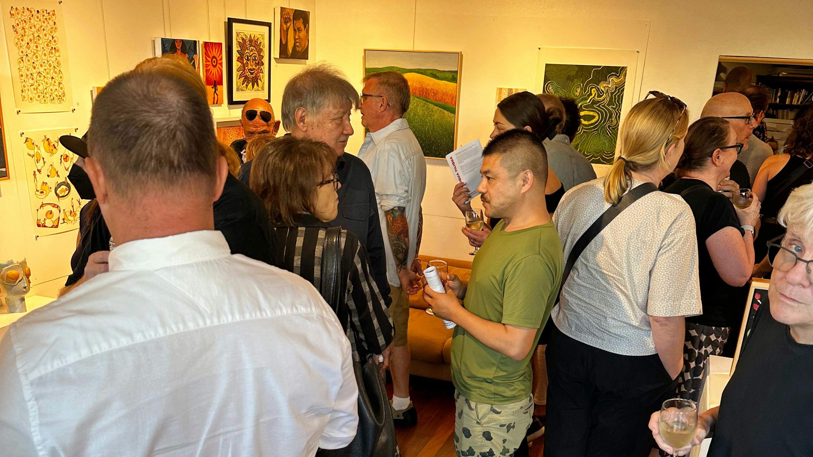 People attending an opening at Tiliqua Tiliqua