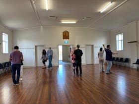 People enjoying a dancing lesson
