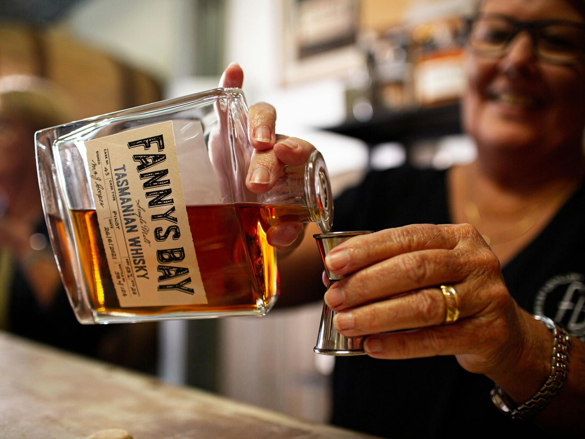 Woman pouring whisky