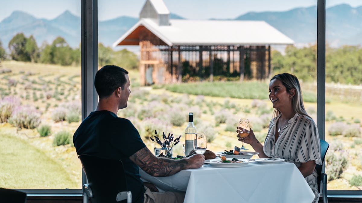Young couple visiting Kooroomba Vineyards on the Scenic Rim Tour