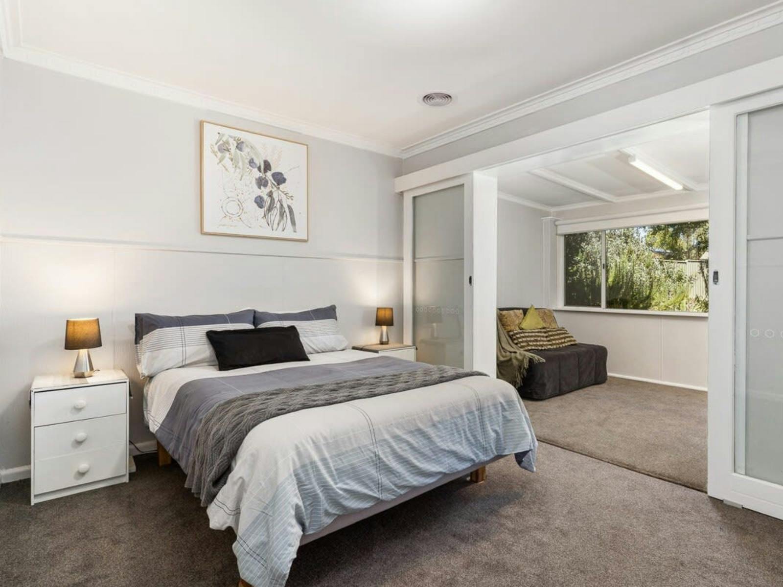 Bedroom with an opening to a reading nook