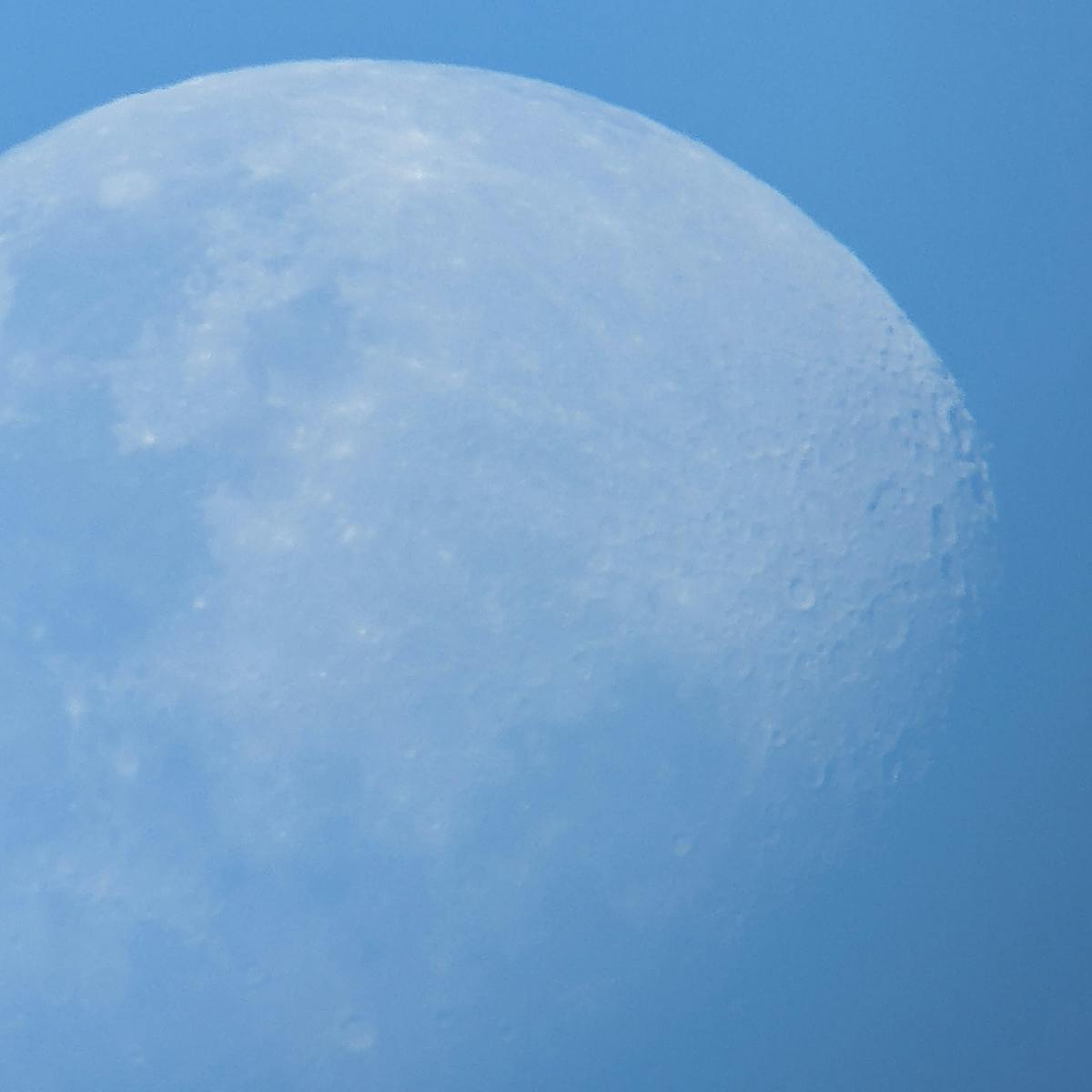 telescope view of the moon during daytime