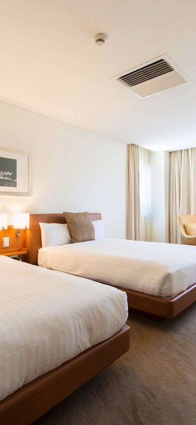 Twin Double Room features 2 Queen Sleepmaker beds