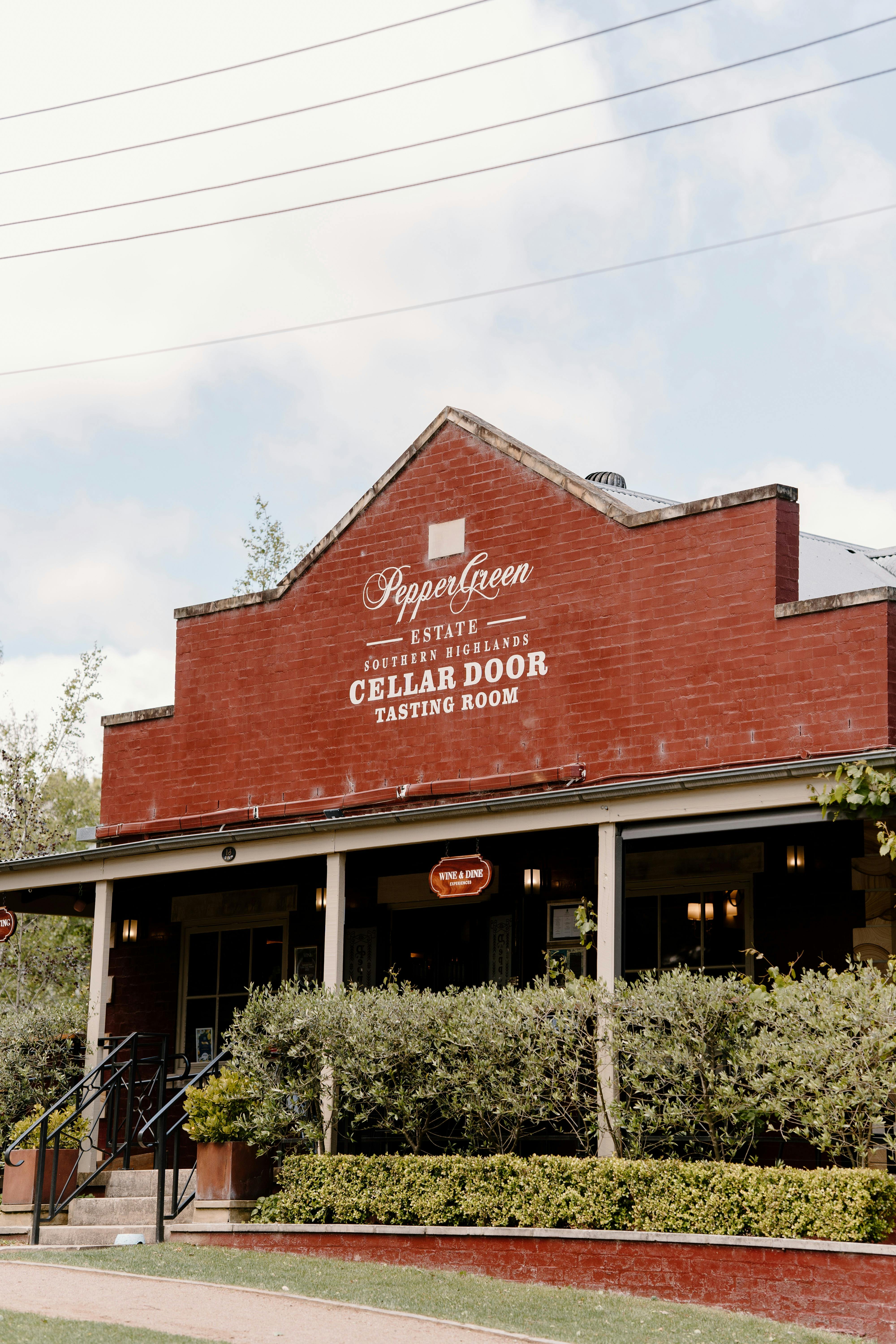Exterior shot of the PepperGreen Estate building, the building is red brick