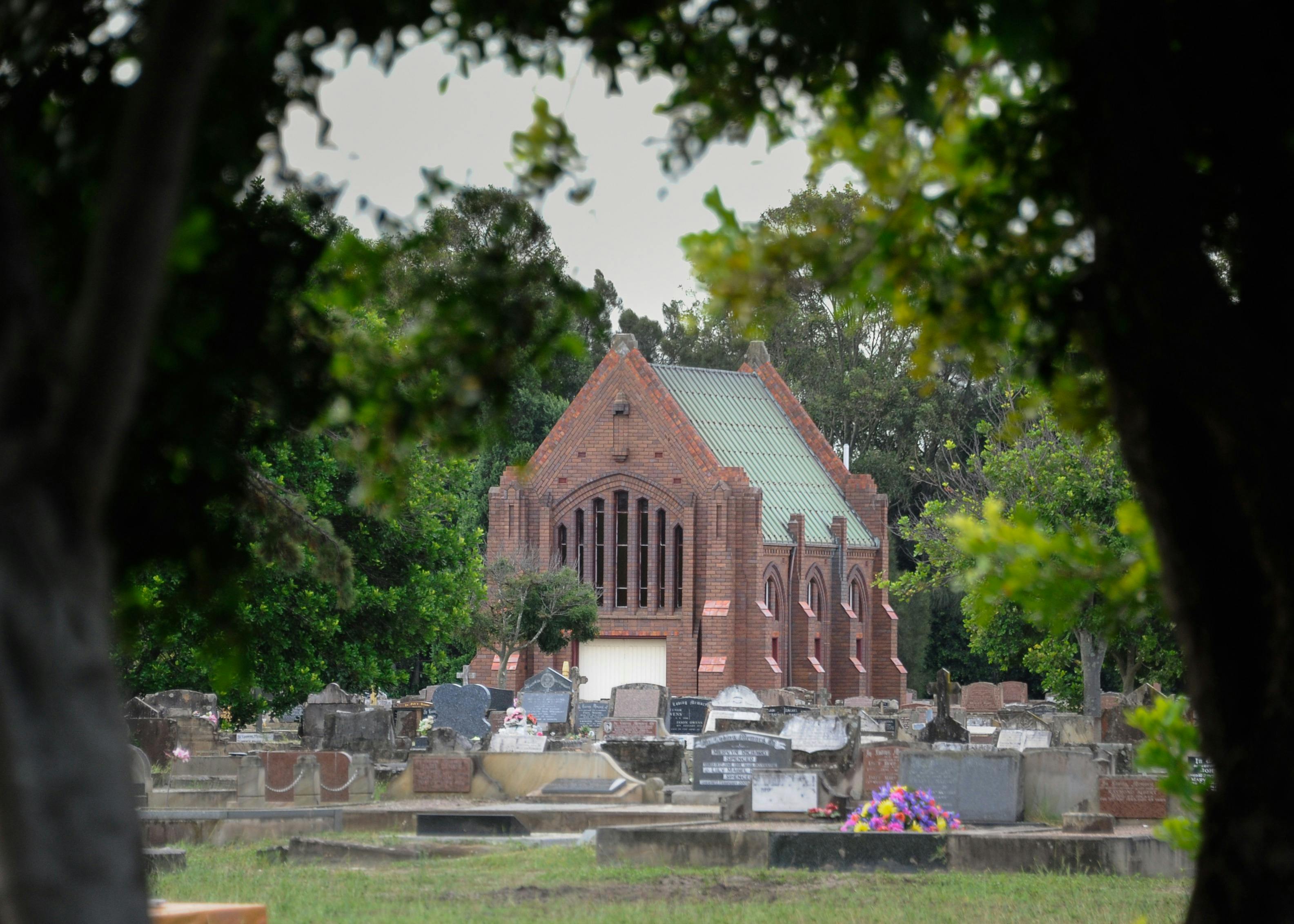 historic chapel surrounded by gravestones