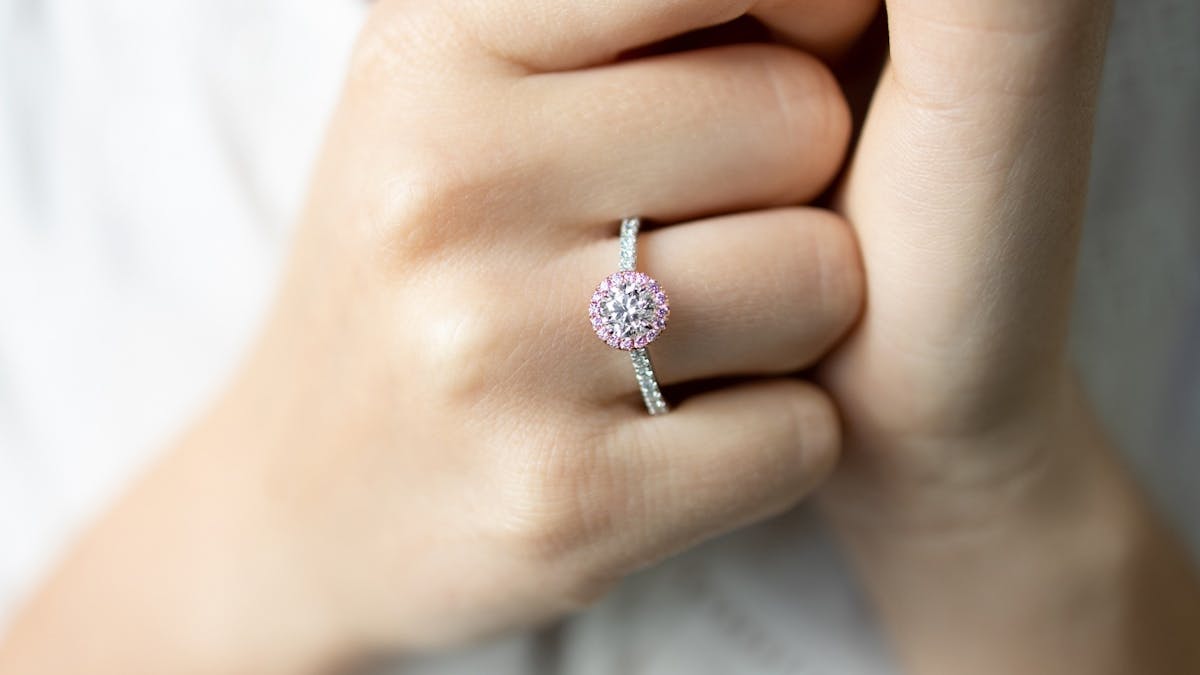 white-gold-pink-sapphire-halo-diamond-engagement-ring